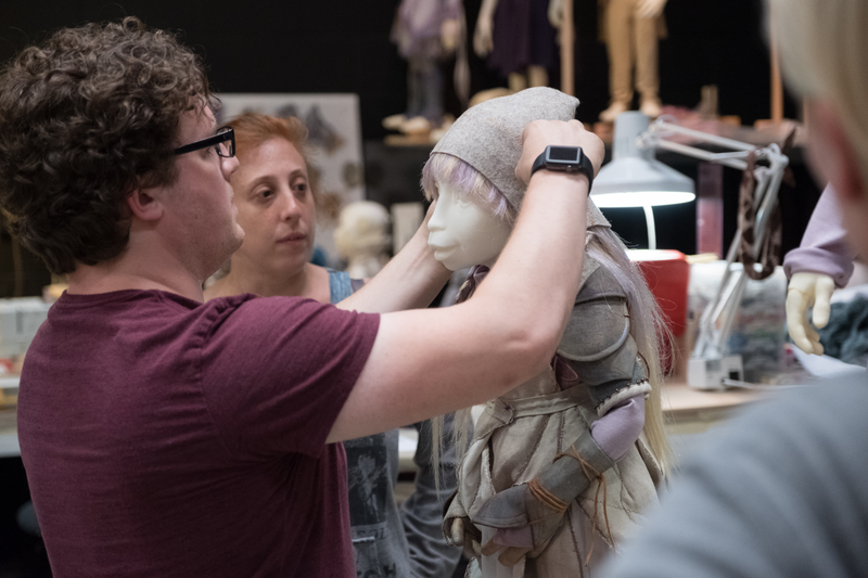 Fitting an outfit and wig for a Gelfling.
